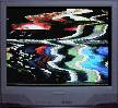 old tv with distored colourful image 
